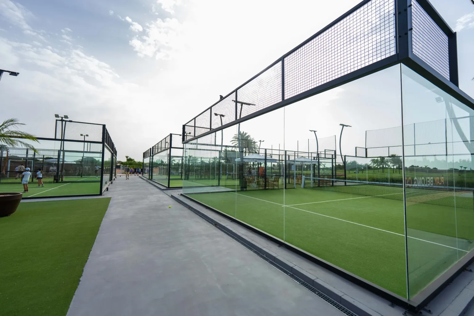 Walkway between glass courts