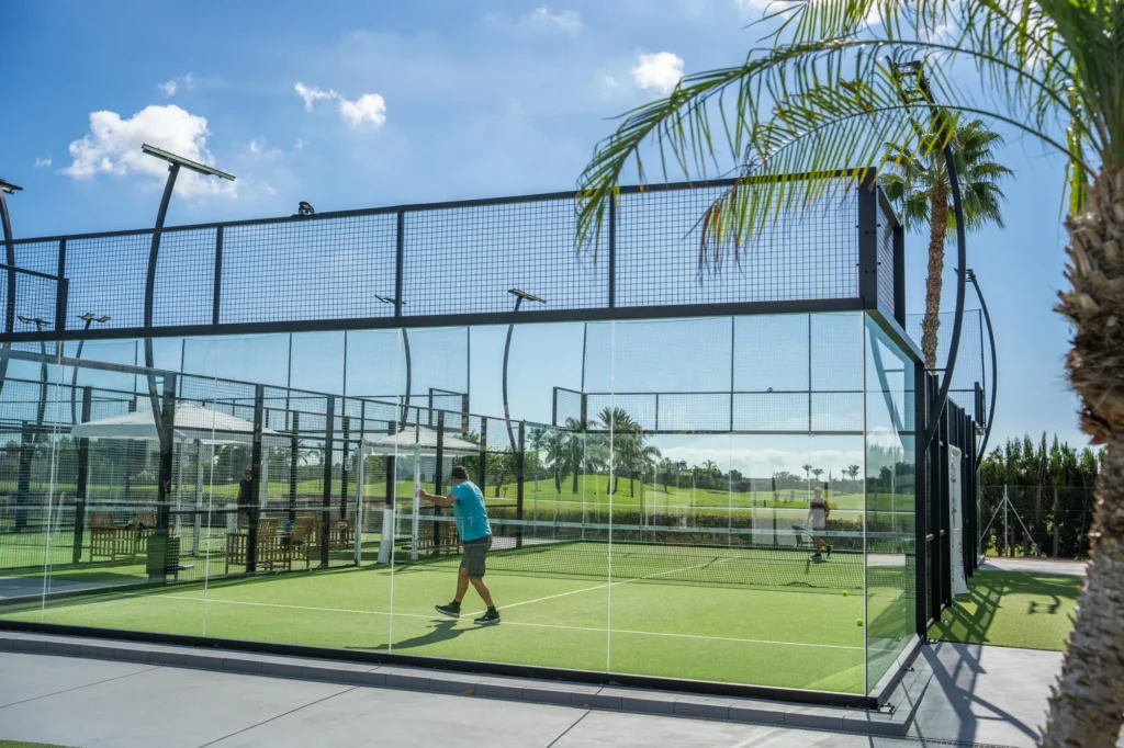 Glass court among palm trees